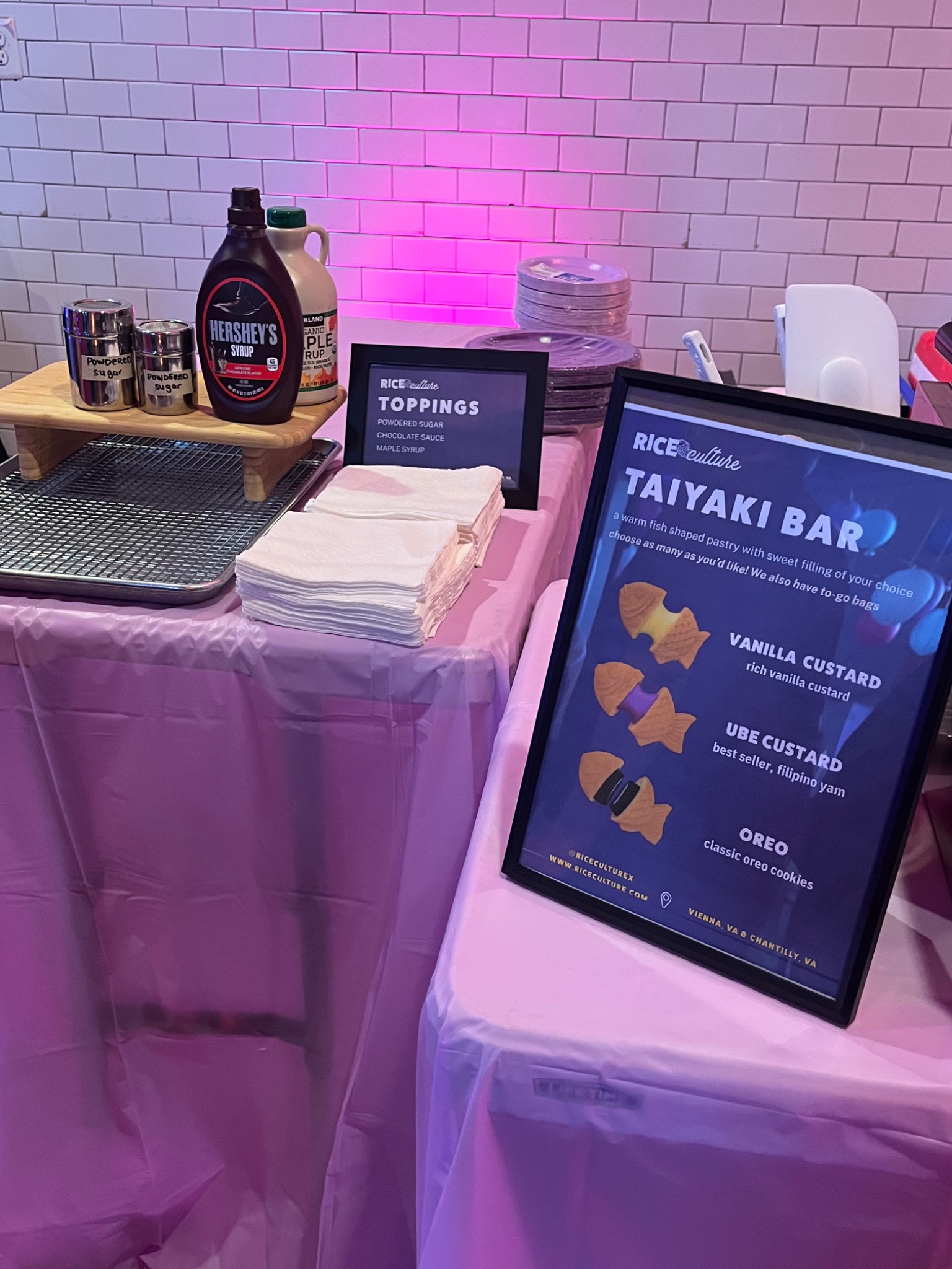 Toppings, plates and napkins on the taiyaki bar