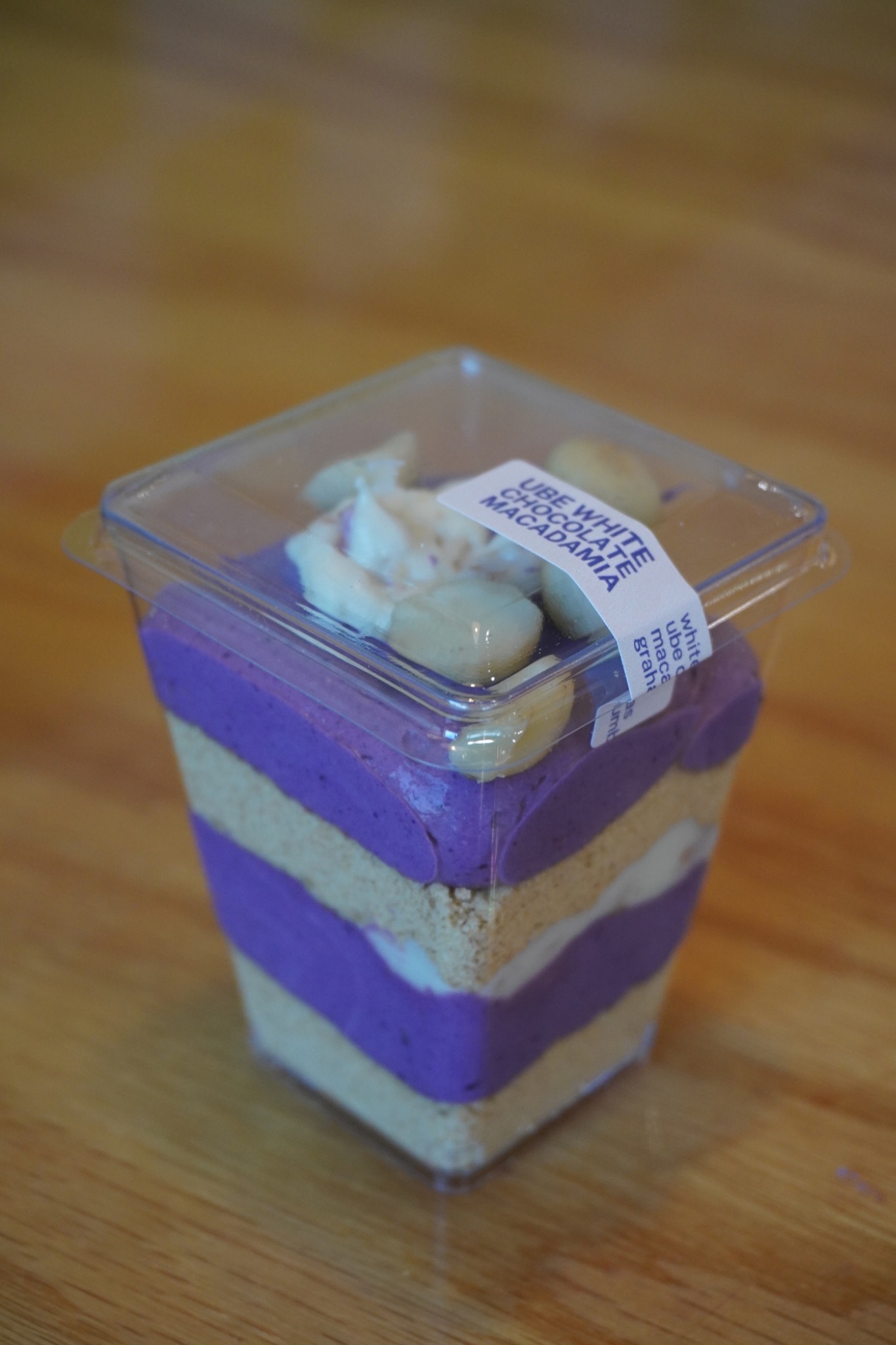 Close-up of a purple layered Rice Culture dessert shooter